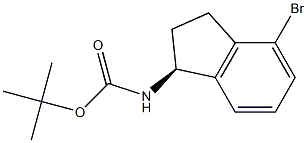 Carbamic acid, N-[(1S)-4-bromo-2,3-dihydro-1H-inden-1-yl]-, 1,1-dimethylethyl ester Structure